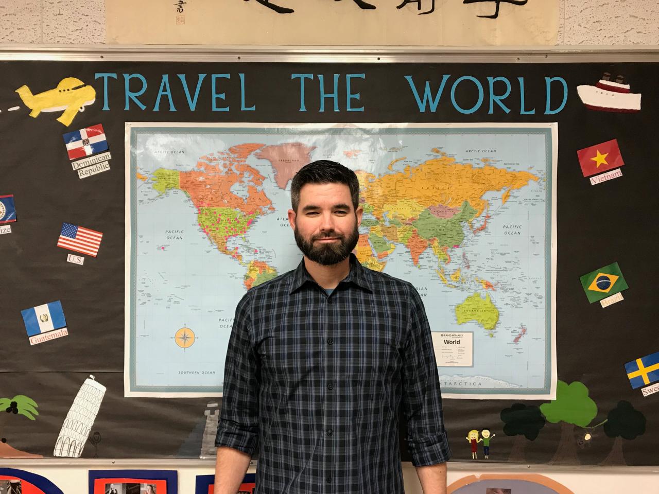 High school teacher, John-David Bowman, poses for a portrait in a classroom in Mesa, Arizona, U.S., in this handout photo provided April 4, 2018.    Courtesy Rebecca Nicol/Handout via REUTERS